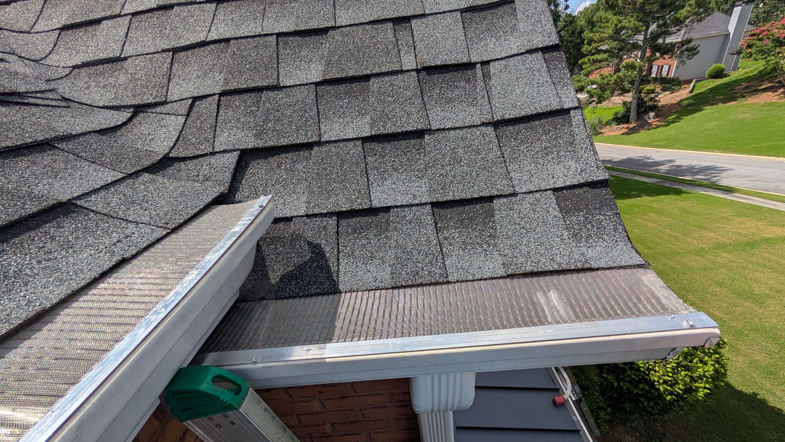 Close up of stainless steel micro mesh gutter guard installation